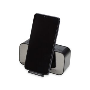 Caixa de som bluetooth com relógio, despertador e suporte de celular.
